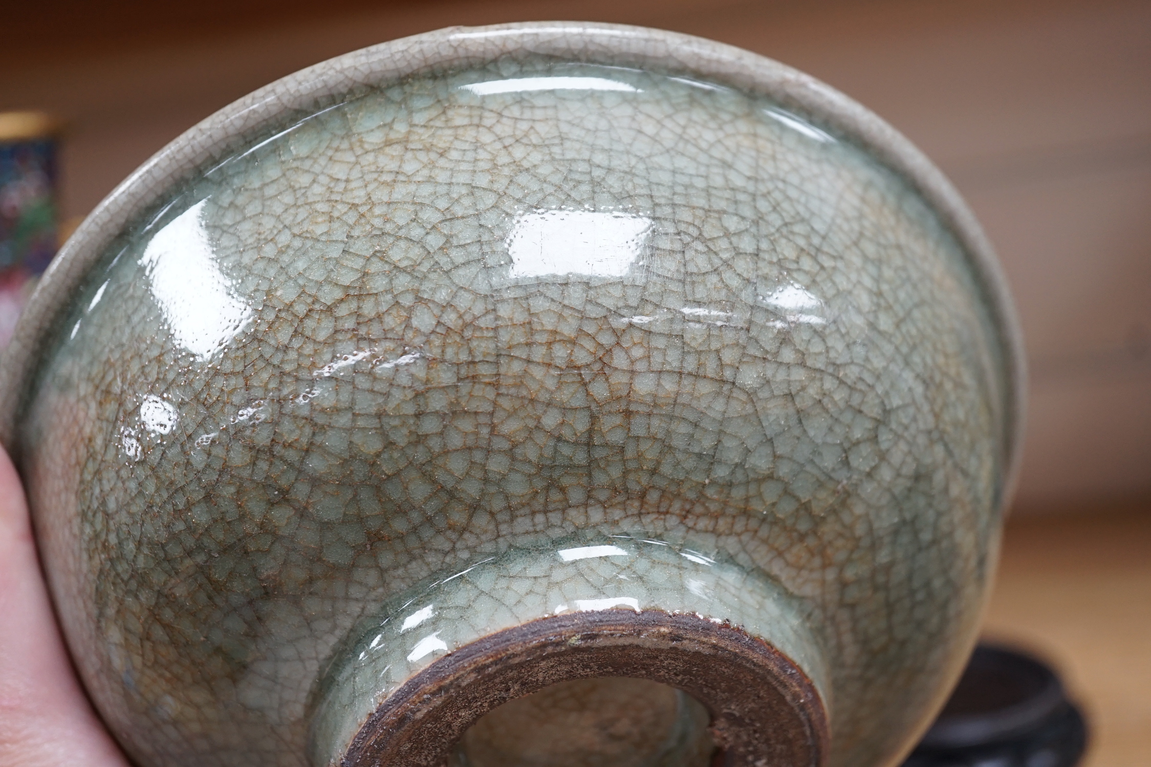 A Chinese Guan type green crackle glaze bowl, early 20th century 19cm diameter, on hardwood stand
